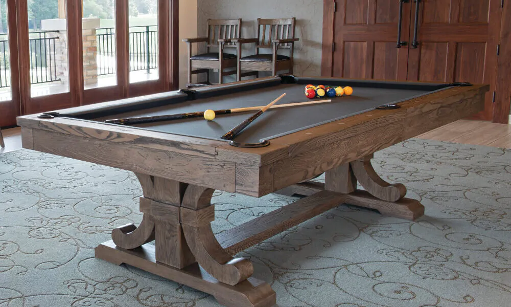 Upgrade Your Living Space | pool table with pool cues on it in a carmel color