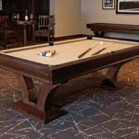 room setting featuring pool table with billiards accessories on its playing surface